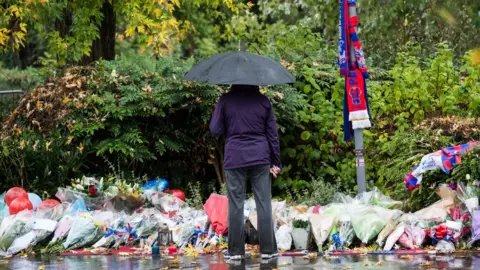 Getty Images Floral tributes for tram crash victims