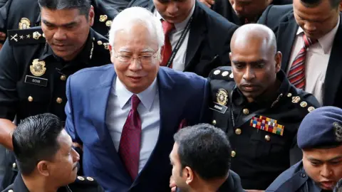 Reuters Mr Najib arriving in court on 4 July