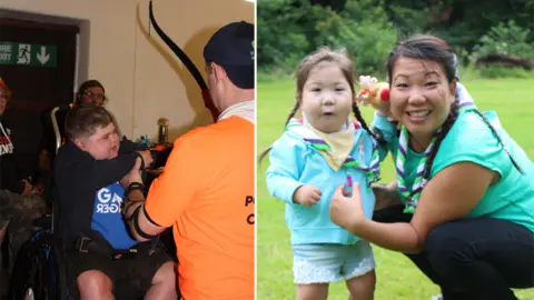 Ty Hafan Scout Group A boy in a wheelchair doing archery and a girl and woman