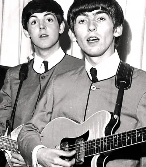 PA Paul McCartney with George Harrison and his Maton guitar