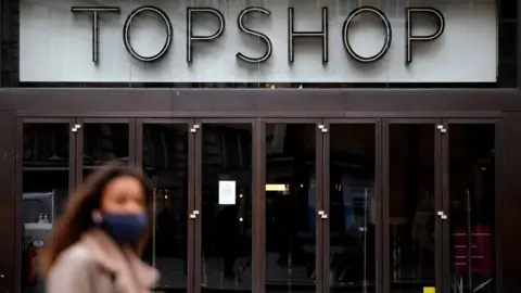 Getty Images Woman walks by Topshop