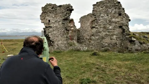 Archaeologists at the site of St Dwynwen's ruin