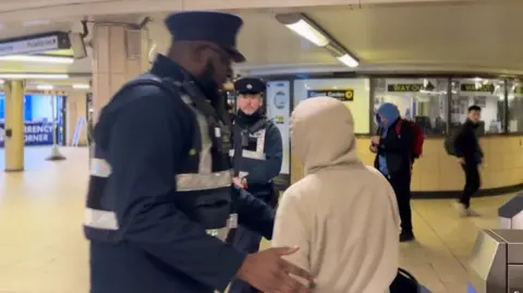 TfL Enforcement officers intercepting fare-dodgers