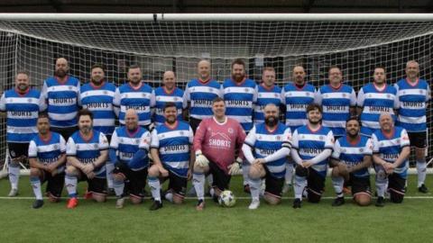 XL FC team photo is blue and white hooped football shirts