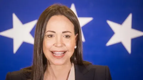 EPA Former representative Maria Corina Machado offers statements to journalists in Caracas, Venezuela 24 October 2023.