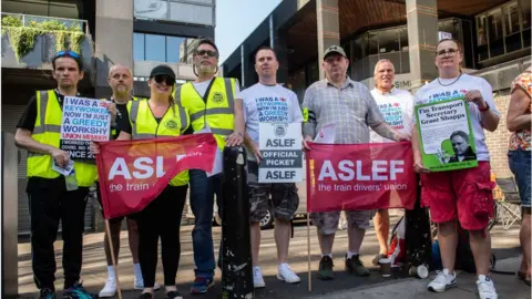 Getty Images Striking train drivers picket Euston station in August