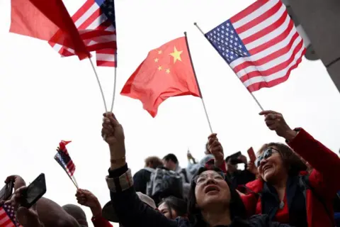 Reuters Supporters of Chinese President Xi Jinping gather outside a hotel where the Chinese delegation is staying during the APEC Summit in San Francisco, California, U.S., November 14, 2023.