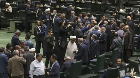 Getty Images Iranian Parliamentarians gather for a parliament session in Tehran on October 4, 2022