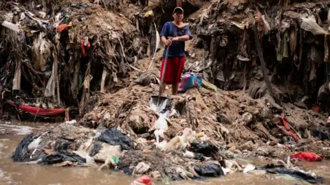 Reuters A man poses for a portrait after working in the polluted waters of the Las Vacas river