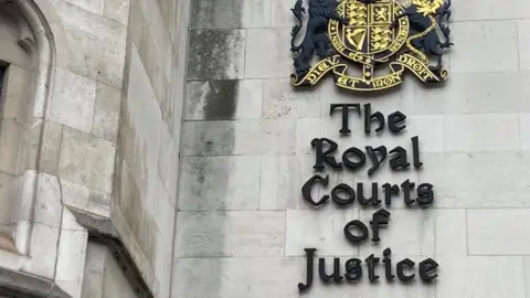 Brian Farmer/BBC Sign saying Royal Courts of Justice complex