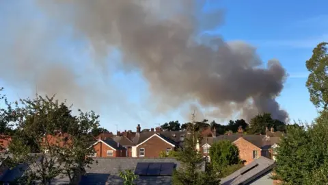 Steve Martin/BBC Plume of smoke over houses in Ipswich