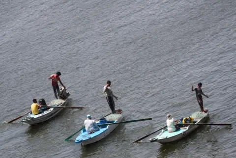 Reuters Men fish from boats on the River Nile in Cairo, Egypt