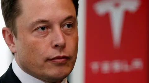 Reuters Tesla Motors Inc Chief Executive Elon Musk pauses during a news conference in Tokyo September 8, 2014.