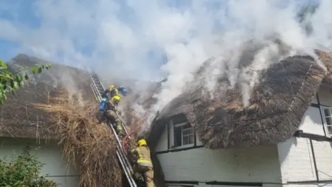 Dorset and Wiltshire Fire and Rescue Service The fire at the thatched property in Urchfont