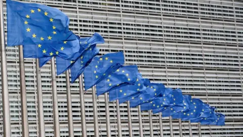 Reuters European Union flags flutter outside the EU Commission headquarters in Brussels,