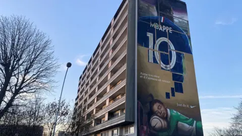 Reuters A mural of Kylian Mbappe in the Paris suburbs