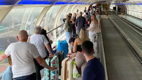 Chris Pike Manchester Airport queues