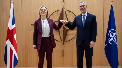 EPA Nato Secretary General Jens Stoltenberg (R) greets British Foreign Secretary Liz Truss