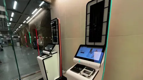 Two of the automatic machines which Eurostar passengers will use to scan their passport, scan their fingerprints, and have a photo taken, under the Entry Exit System. But these machines aren't yet being used, with French border police doing a part of the process at their booths instead.