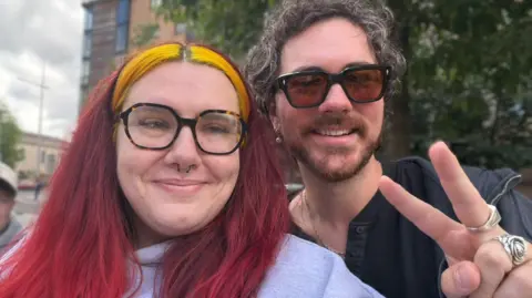Jess Hallatt Jess Hallatt from Sheffield pictured in Belfast with Irish singer Cian Ducrot