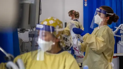 PA Media Nurses work on patients in the Intensive Care Unit (ICU) in St George"s Hospital in Tooting in early January 2021