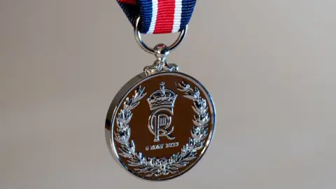 PA Media A 'thank you' medal to be given to frontline workers by the King to mark the Coronation. On one side can be seen the King's royal cypher.