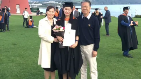 Zi Zeng Zi Zeng with her parents