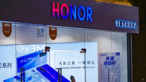 Getty Images Chinese smartphone-maker Huawei is selling its youth-focused budget brand Honor.