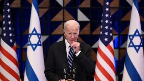 AFP via Getty Images Joe Biden holds a press conference following a solidarity visit to Israel in October