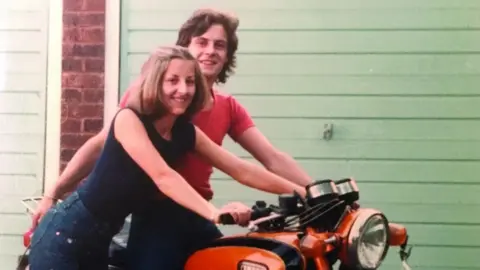 Penny Farmer Chris Farmer and Peta Frampton pictured with Chris's motorbike before they went travelling