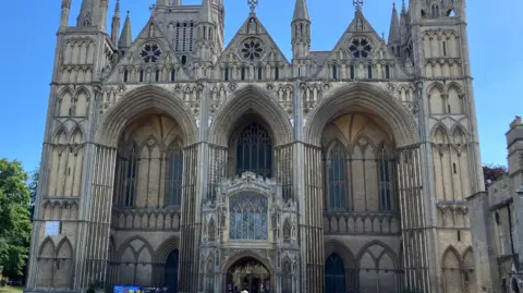 The historic Cathedral with arches on the front and towers seen in the back.