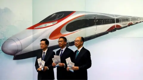 Reuters Hong Kong officials at media event about train station (25 July 2017)