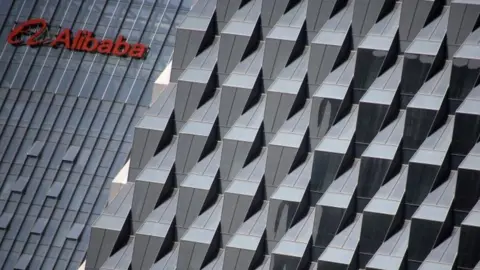 Reuters A logo of Alibaba Group is seen at the company's Beijing headquarters (15 October 2015)