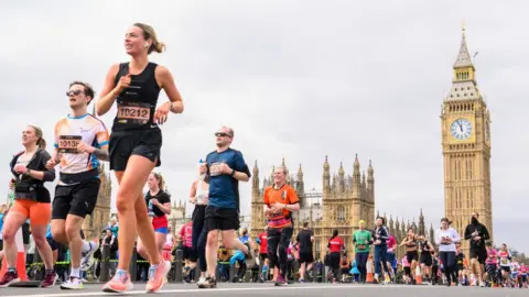 PA Media Marathon runners on Westminster Bridge