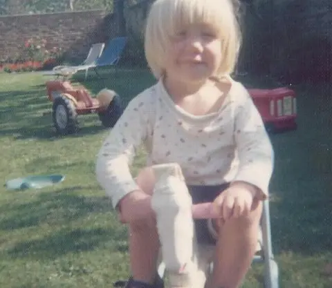 Julia Gahagan Jeremy on his tricycle in his back garden in 1976