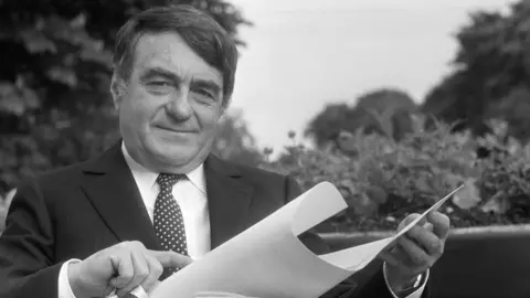 AFP Claude Lanzmann poses after receiving le Prix des Arts et des Lettres in Paris on May 23, 1985