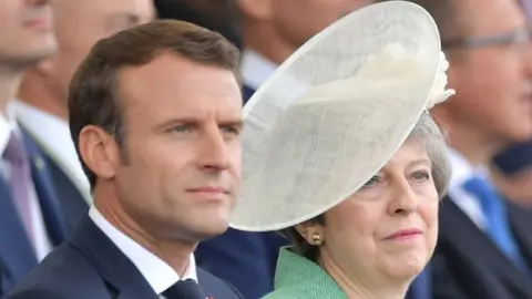 DANIEL LEAL-OLIVAS/AFP/Getty Images Emmanuel Macron and Theresa May