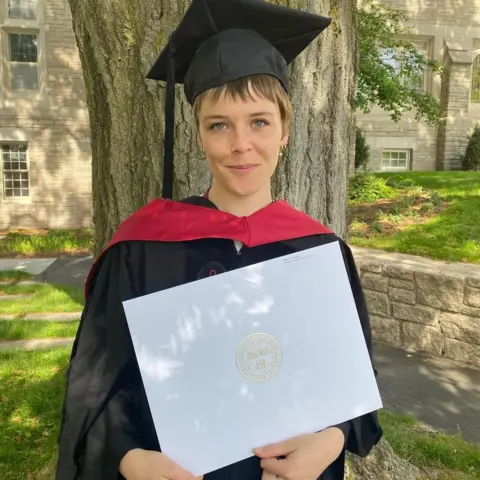 Maggie Rogers Maggie Rogers with her Masters degree