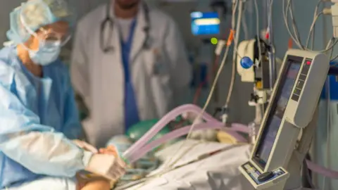 Getty Images Doctor uses ventilator