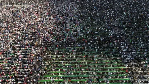 Reuters Drone view of worshippers attending prayers in Tirana, Albania