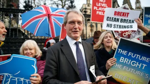 Getty Images Owen Paterson in front of pro-Brexit campaigners