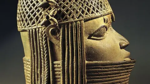 Getty Images Thousands of sculptures and carvings were taken during the destruction of Benin City in present-day Nigeria