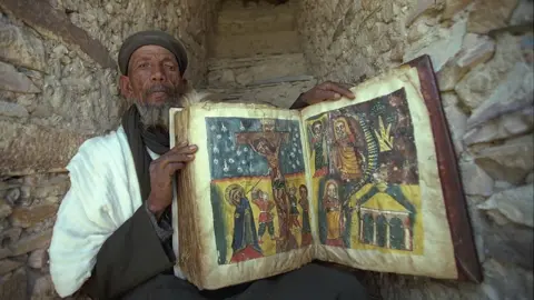 Getty Images One of the books which survived the fire in 1995 in which 70% of the library was destroyed.