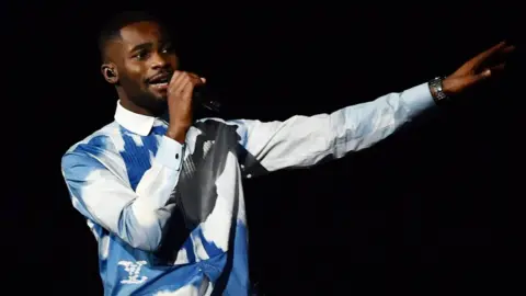 Getty Images Dave performing at the Brit Awards