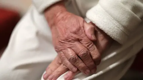 Yui Mok elderly hand