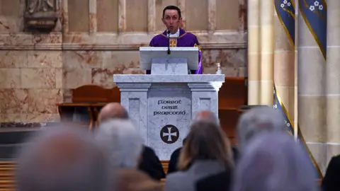 Getty Images Canon Gerald Sharkey at St Andrew's Cathedral in Glasgow