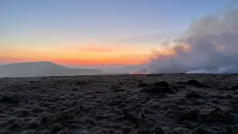 WYFRS Smoke rising from Marsden Moor fire as sun rises