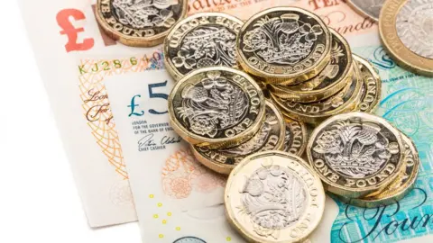 Getty Images Pound coins and notes