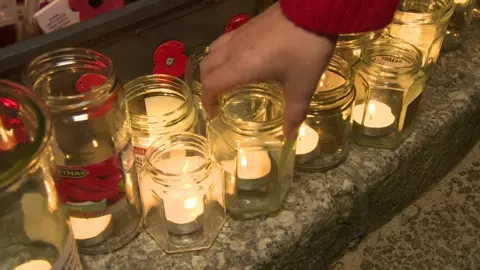 BBC Candles in jars on street