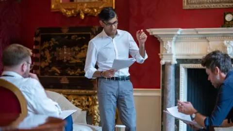UK government Rishi Sunak preparing for his Budget speech at the Treasury